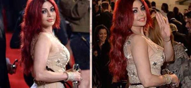 بالصورة - أحمد الفيشاوي يمسك بمؤخرة هيفاء وهبي